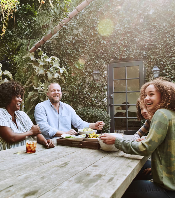 Family smiling at a table