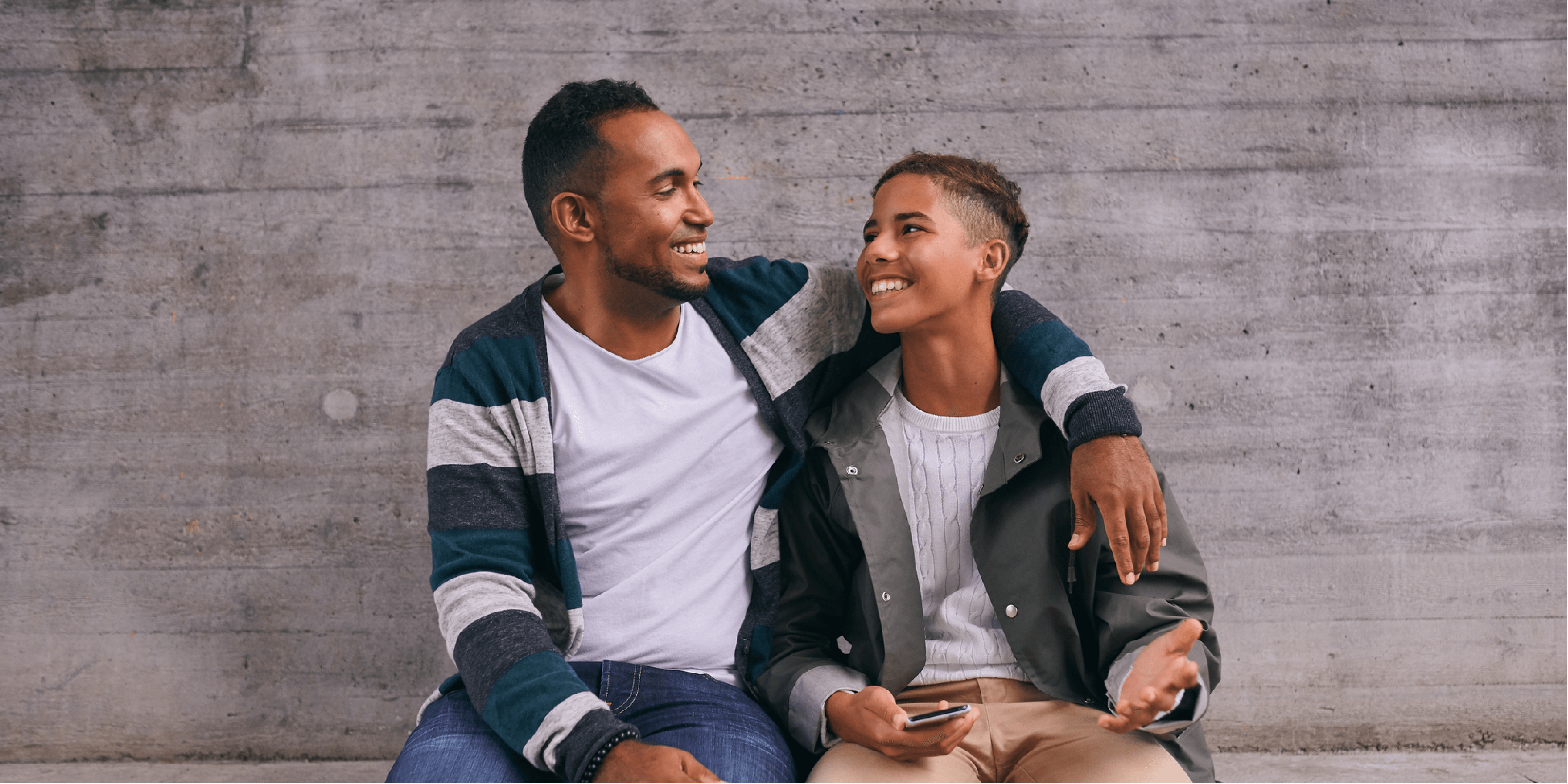 father and son smiling