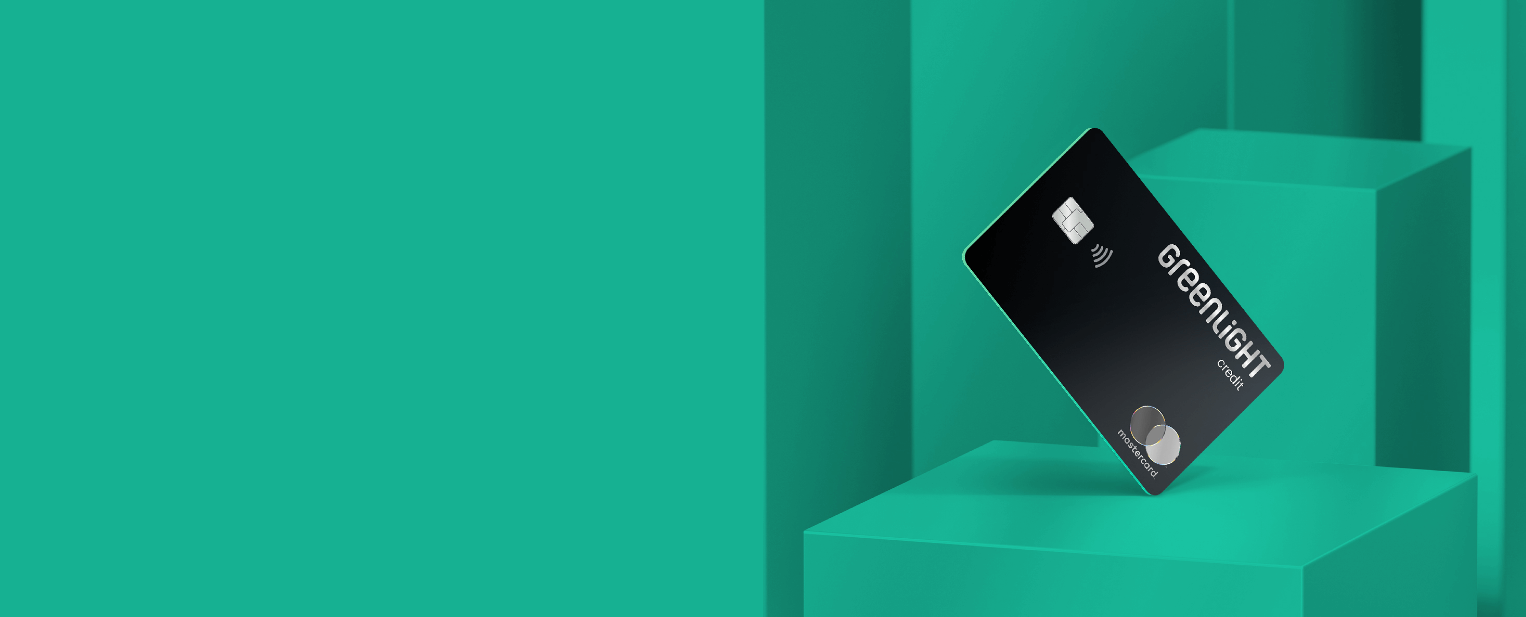 Black Greenlight family cash back credit card against green design