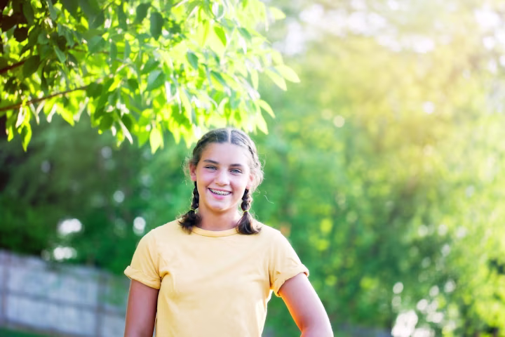 Girl standing outside.