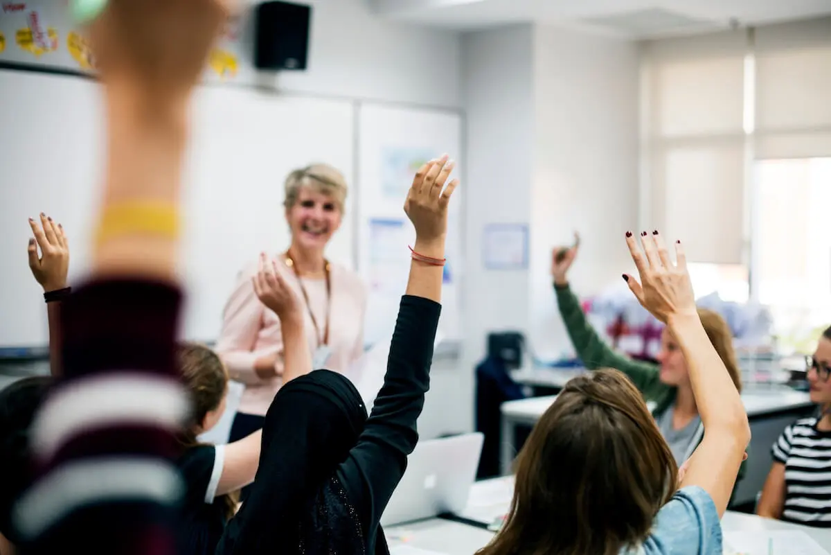 How to prepare for college: students raising their hands