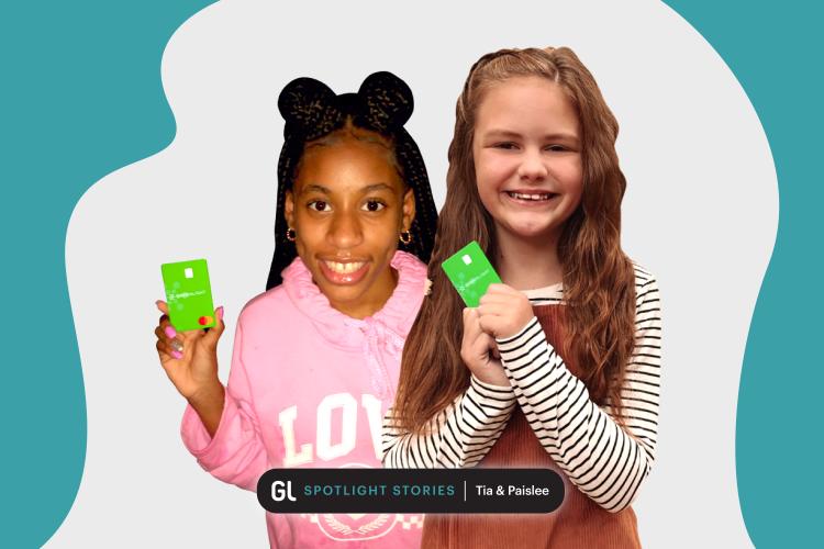 two young girls with greenlight debit cards