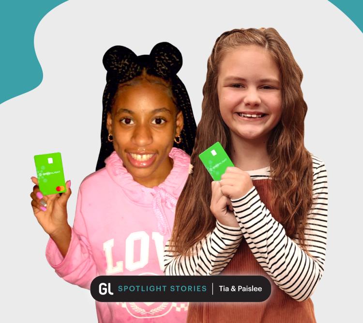 two young girls with greenlight debit cards