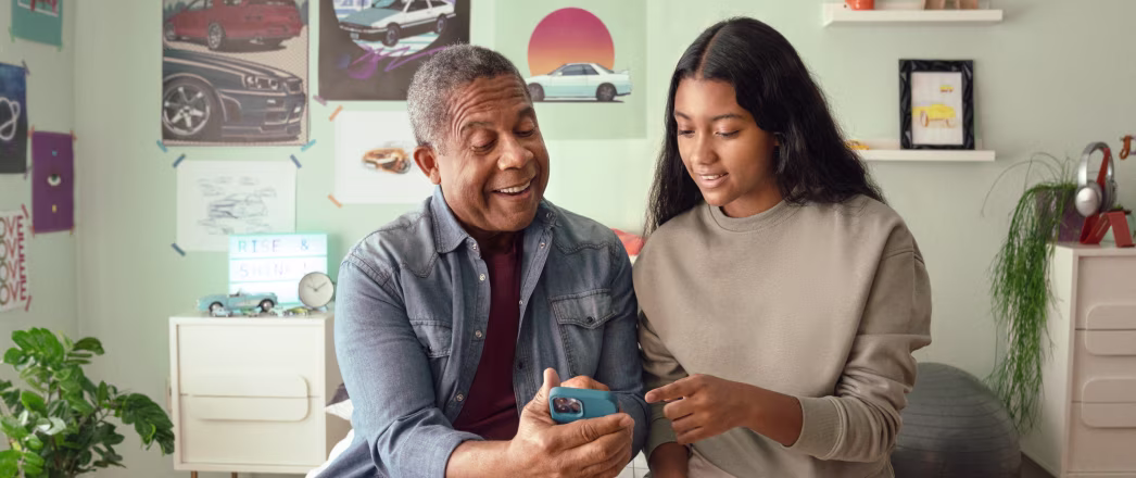 Parent with teen viewing direct deposit statement