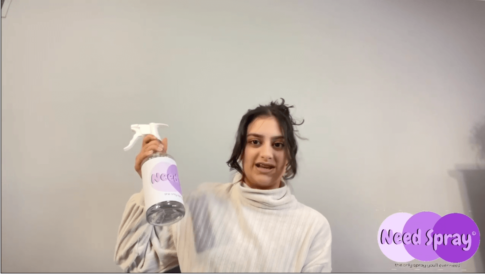 teen girl holding a cleaning spray bottle