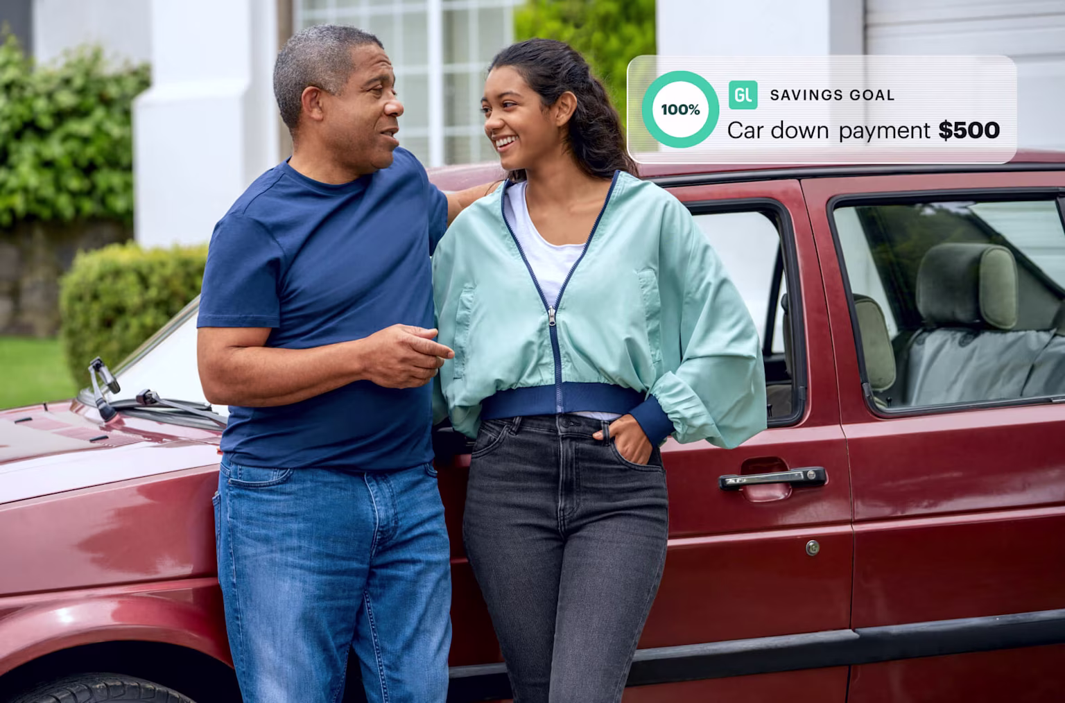Teen girl and proud dad with used car she bought with her job and with Greenlight's Savings Goal feature