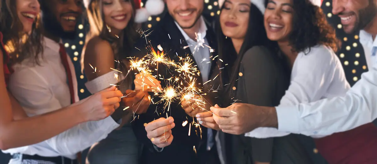 Group of friends holding sparklers