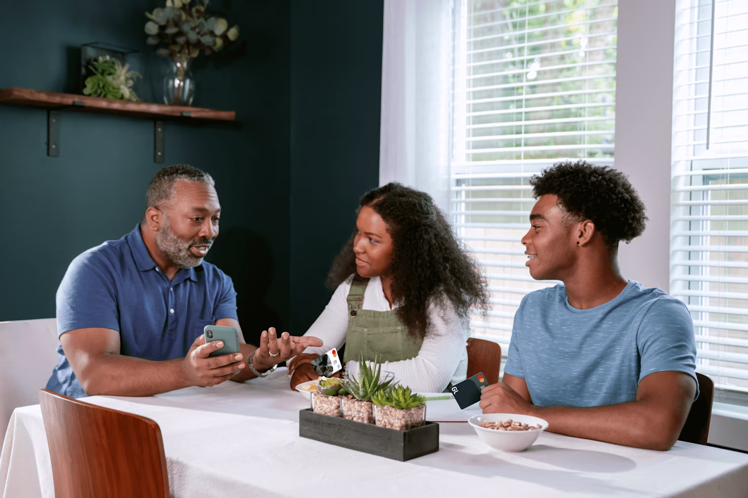 Parent talks to children about financial literacy using Greenlight