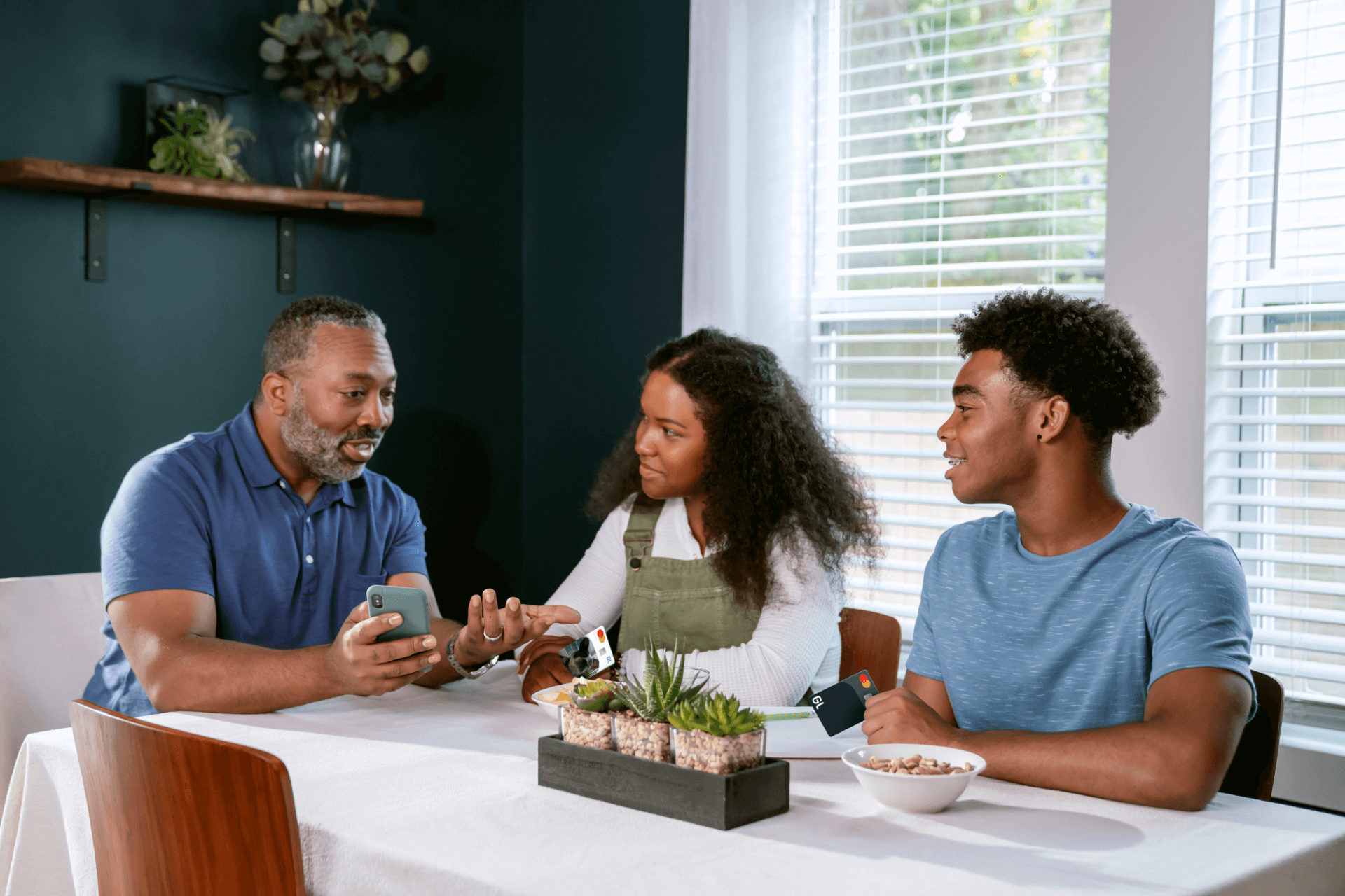 Parent talks to children about financial literacy using Greenlight