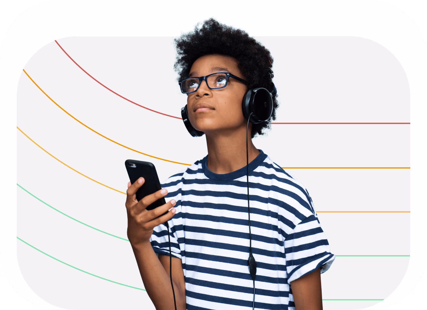 teen boy with his headphones on listening to educational content