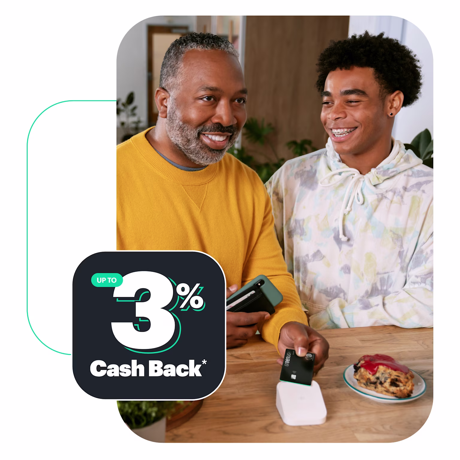 teenage son and his father using the Greenlight Family Cash Card