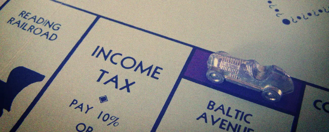 close up of monopoly income tax square