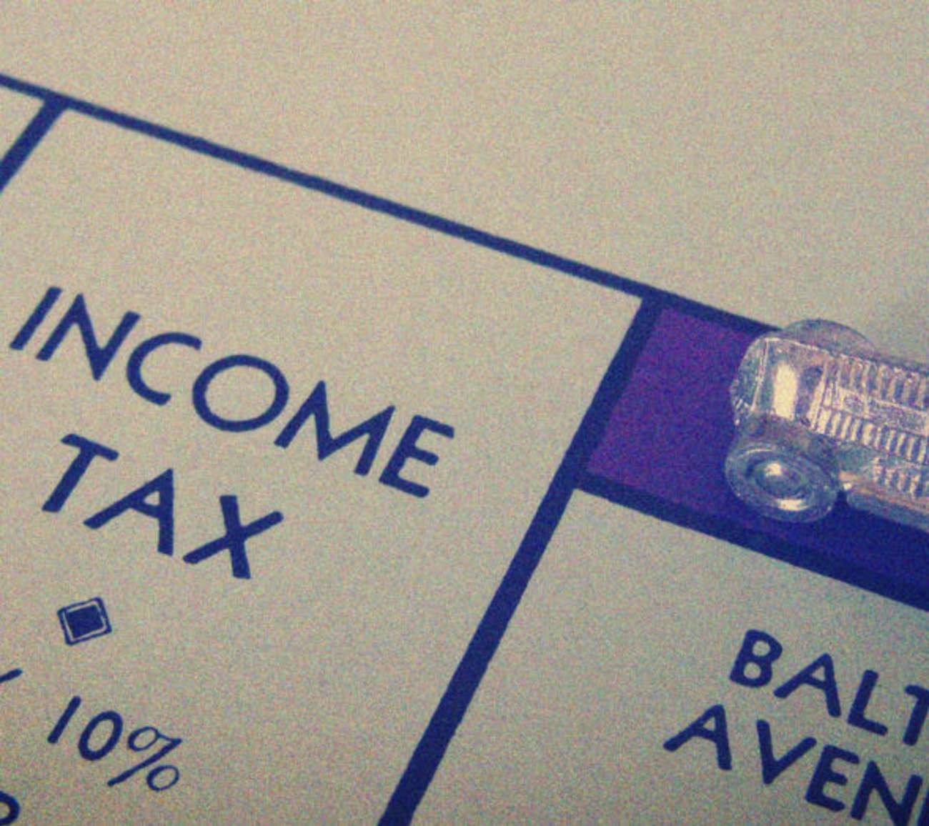 close up of monopoly income tax square