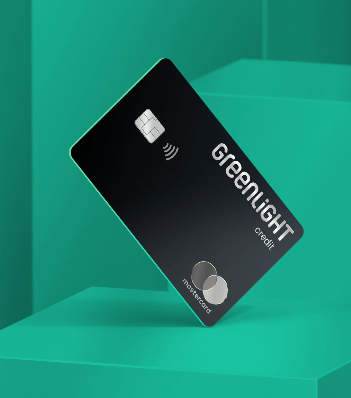 Black Greenlight family cash back credit card against green design
