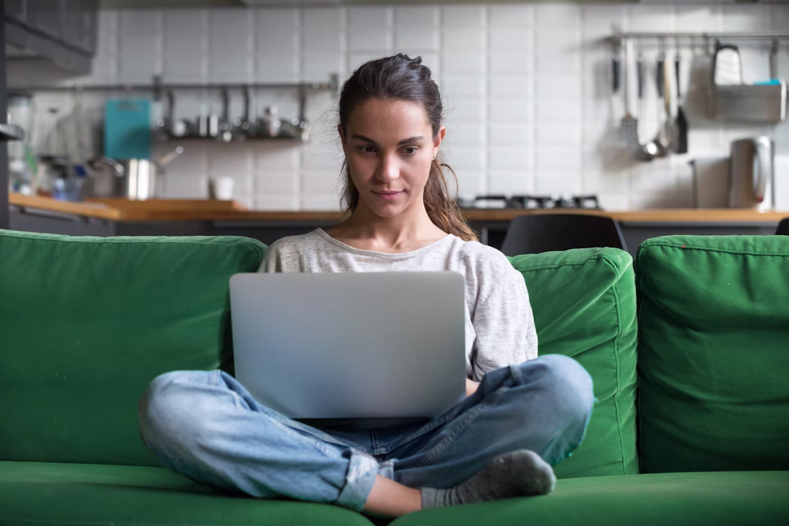 Girl working from her laptop at home and making money