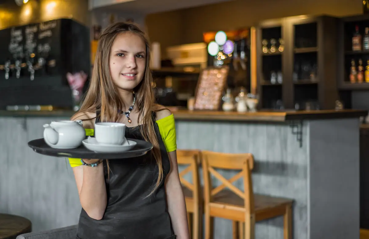 Student working as a waiter