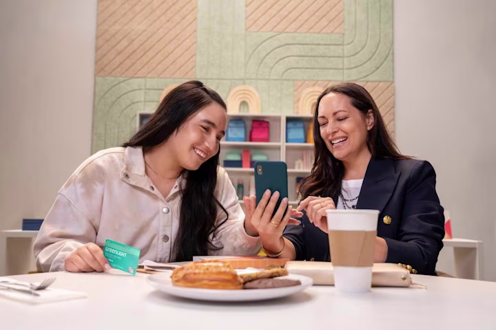 Internet safety: mother and daughter using a phone