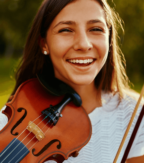 girl holding a violin