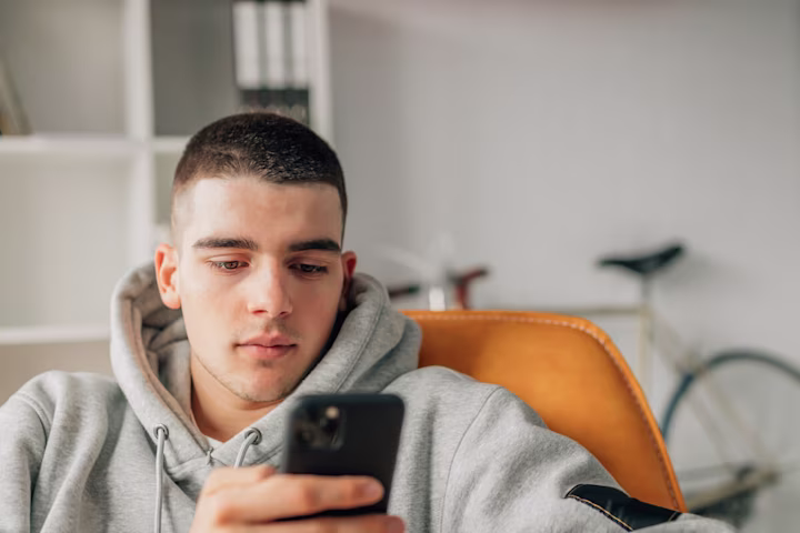 Teenager using a phone