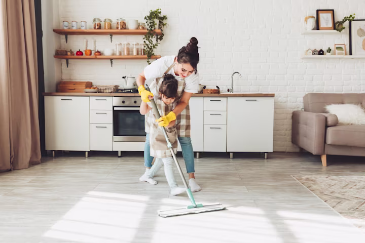 Chores for 5 year olds: mother and daughter mopping the floor