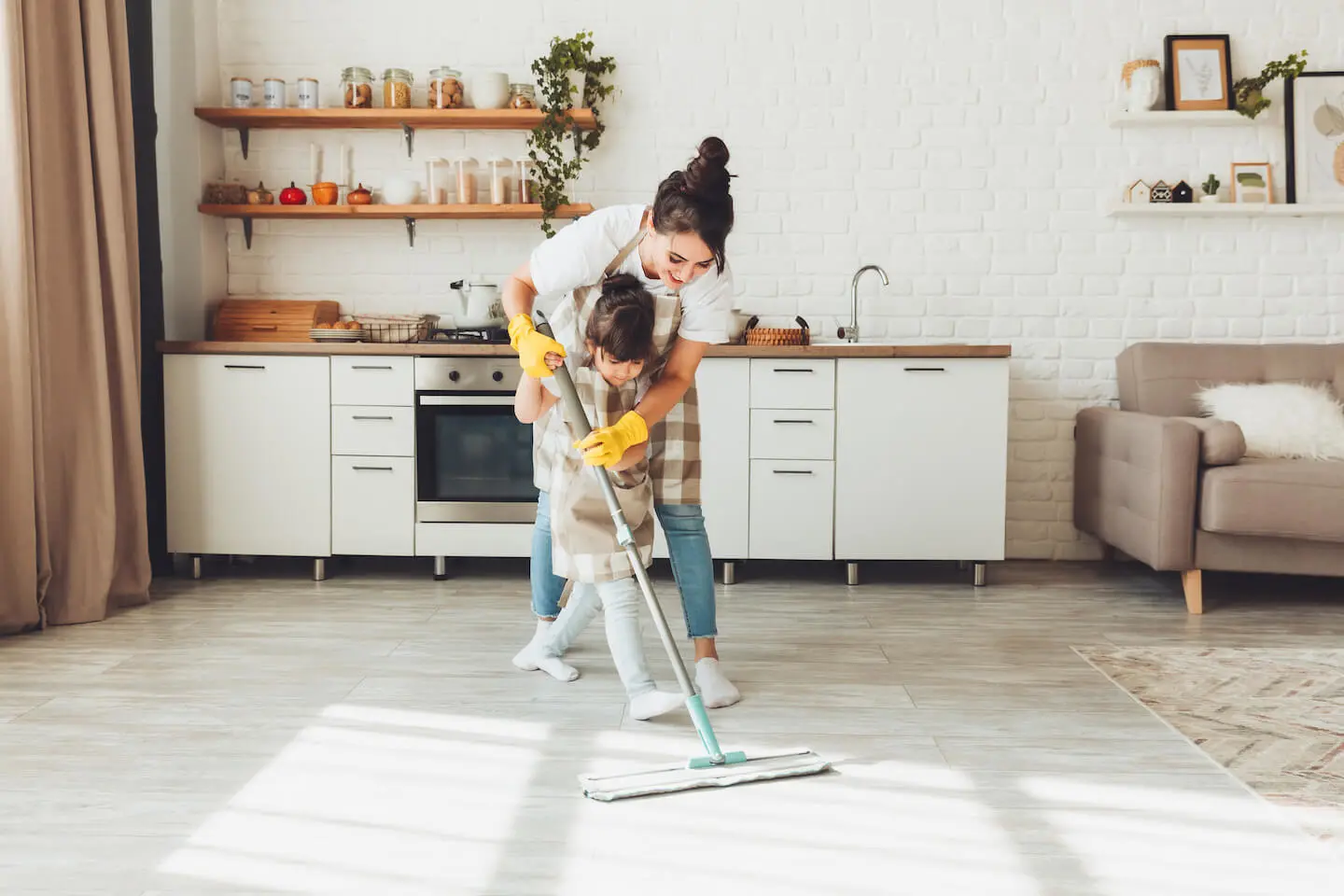 Chores for 5 year olds: mother and daughter mopping the floor