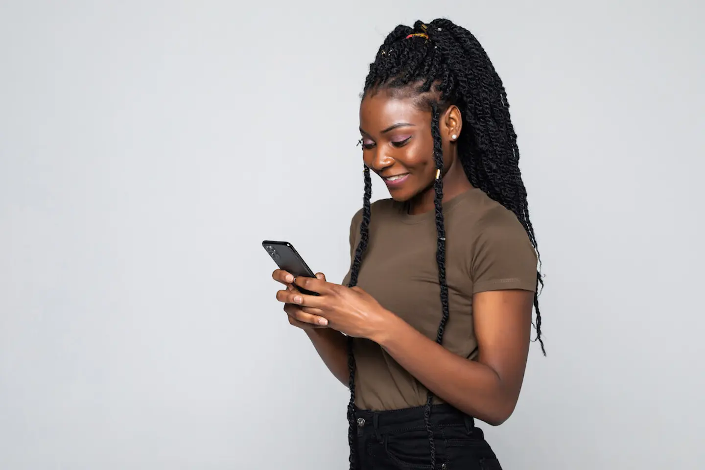 Types of debt: woman using her phone