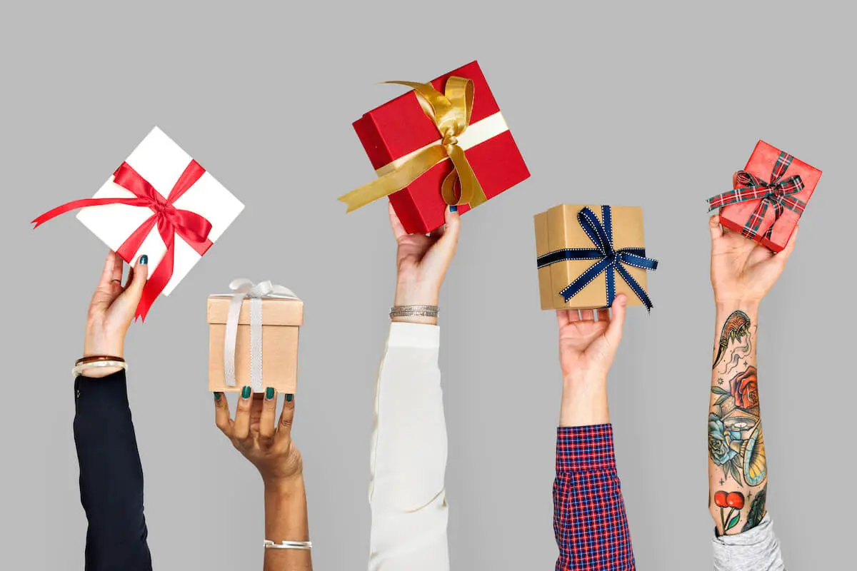 Fun ways to give money: people holding up gift boxes