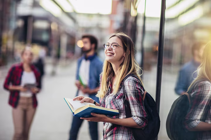 Student happily reading a book