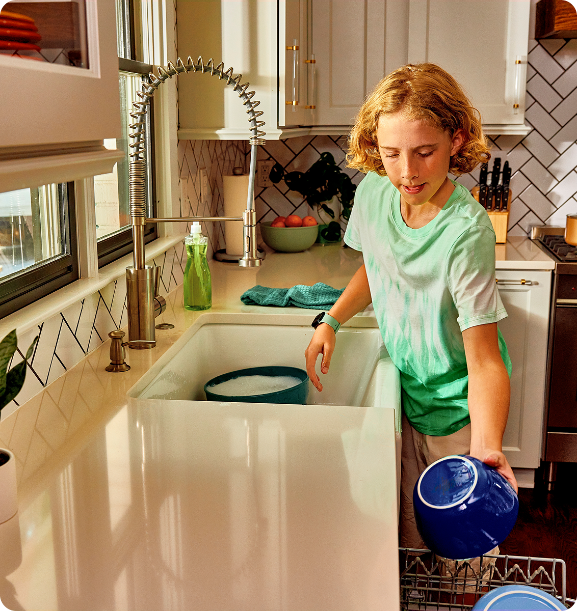 Image of Ryan filling the dishwasher