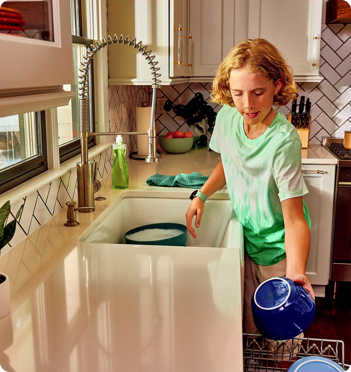 Image of Ryan filling the dishwasher
