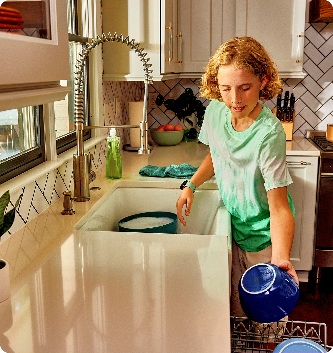 Image of Ryan filling the dishwasher