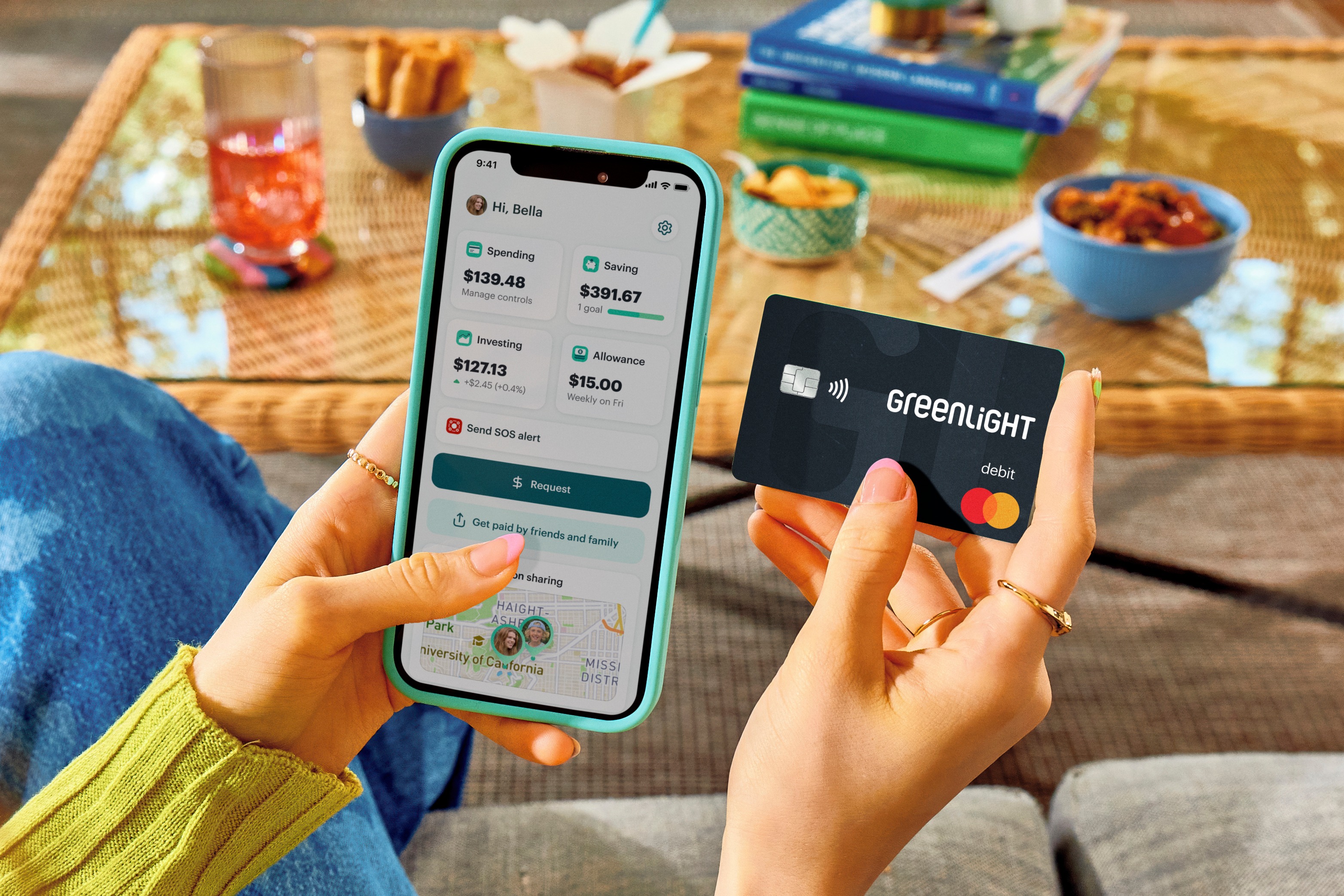 greenlight product holding debit card desktop hero