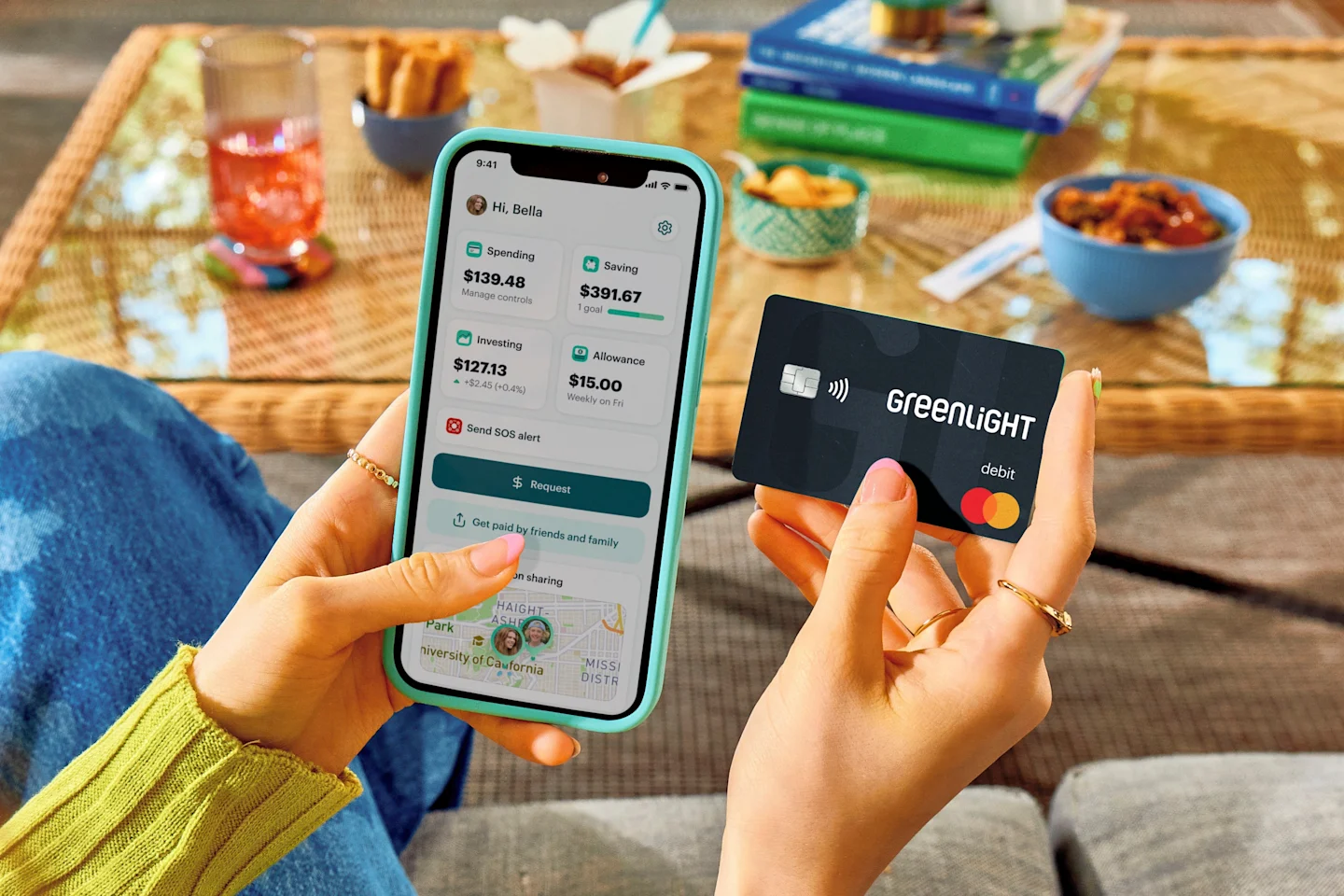 greenlight product holding debit card desktop hero