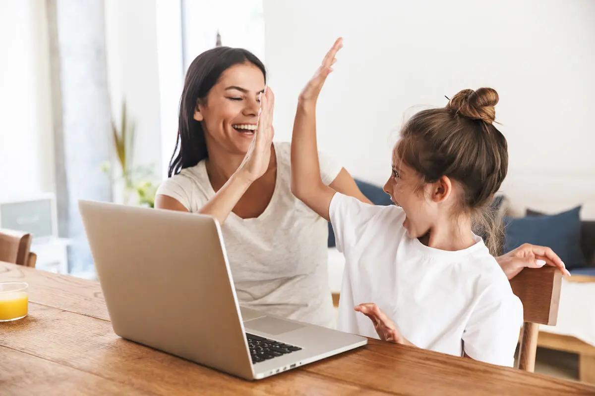 Mother and daughter doing the high five