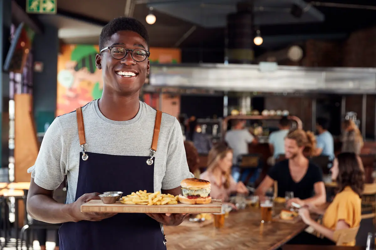 Waiter smiling at the camera