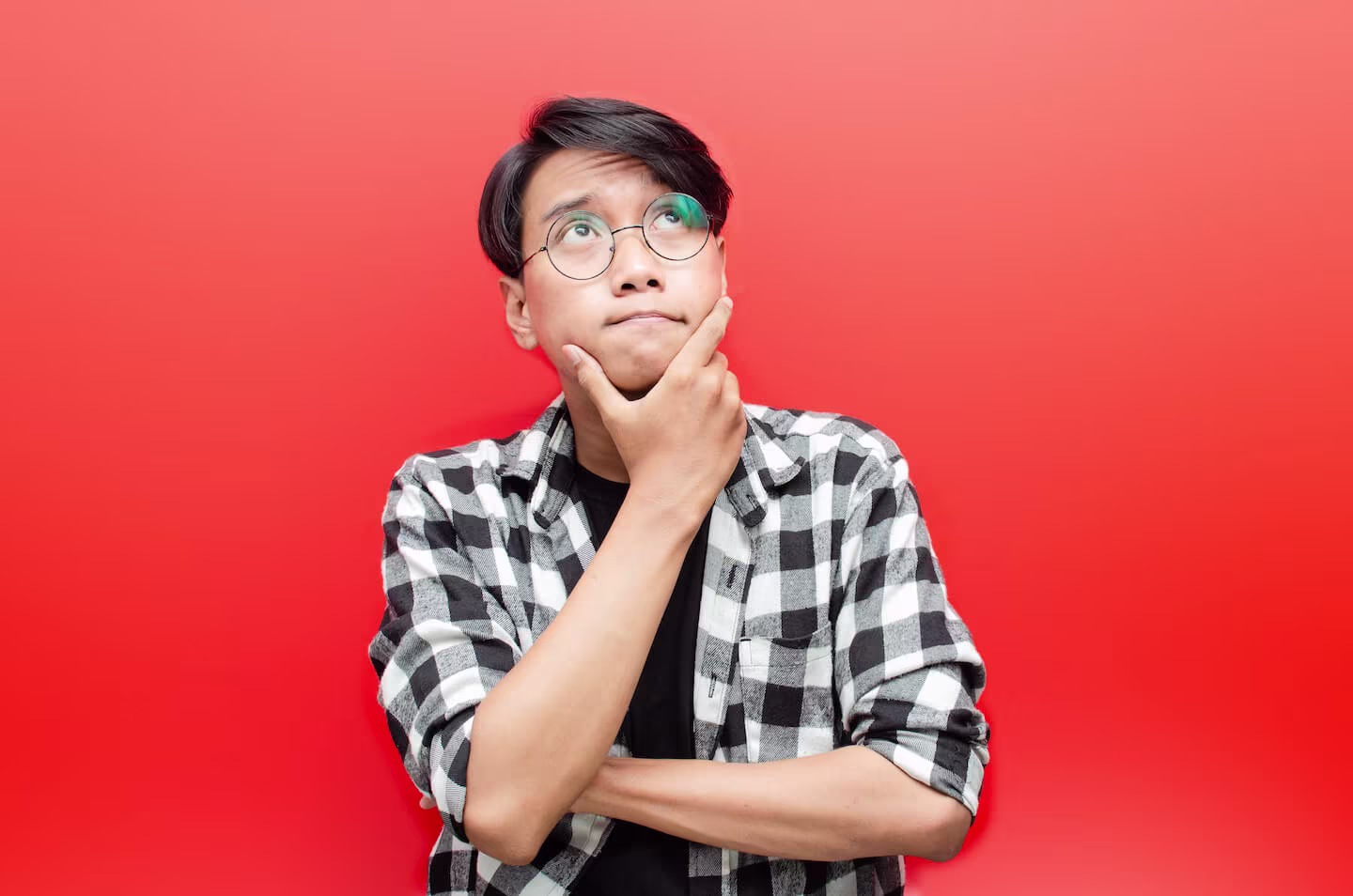 Man looking up while thinking