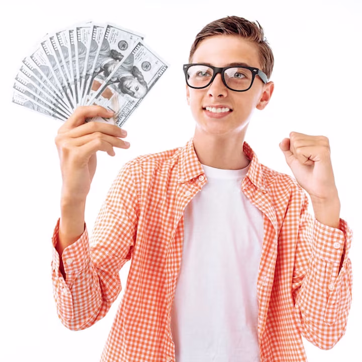 Teenage boy holding some bills