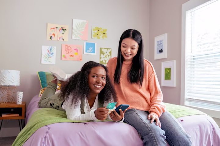 Two teens hanging out in their bedroom wondering how they can start their business as kids or teens