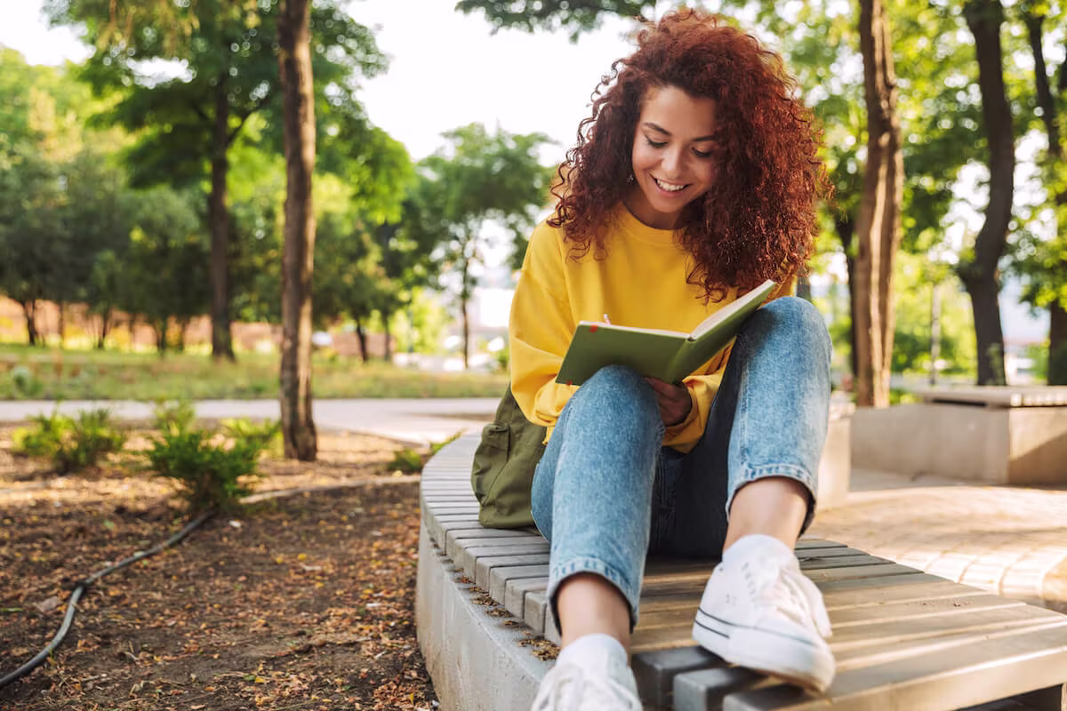 Woman writing on a notebook
