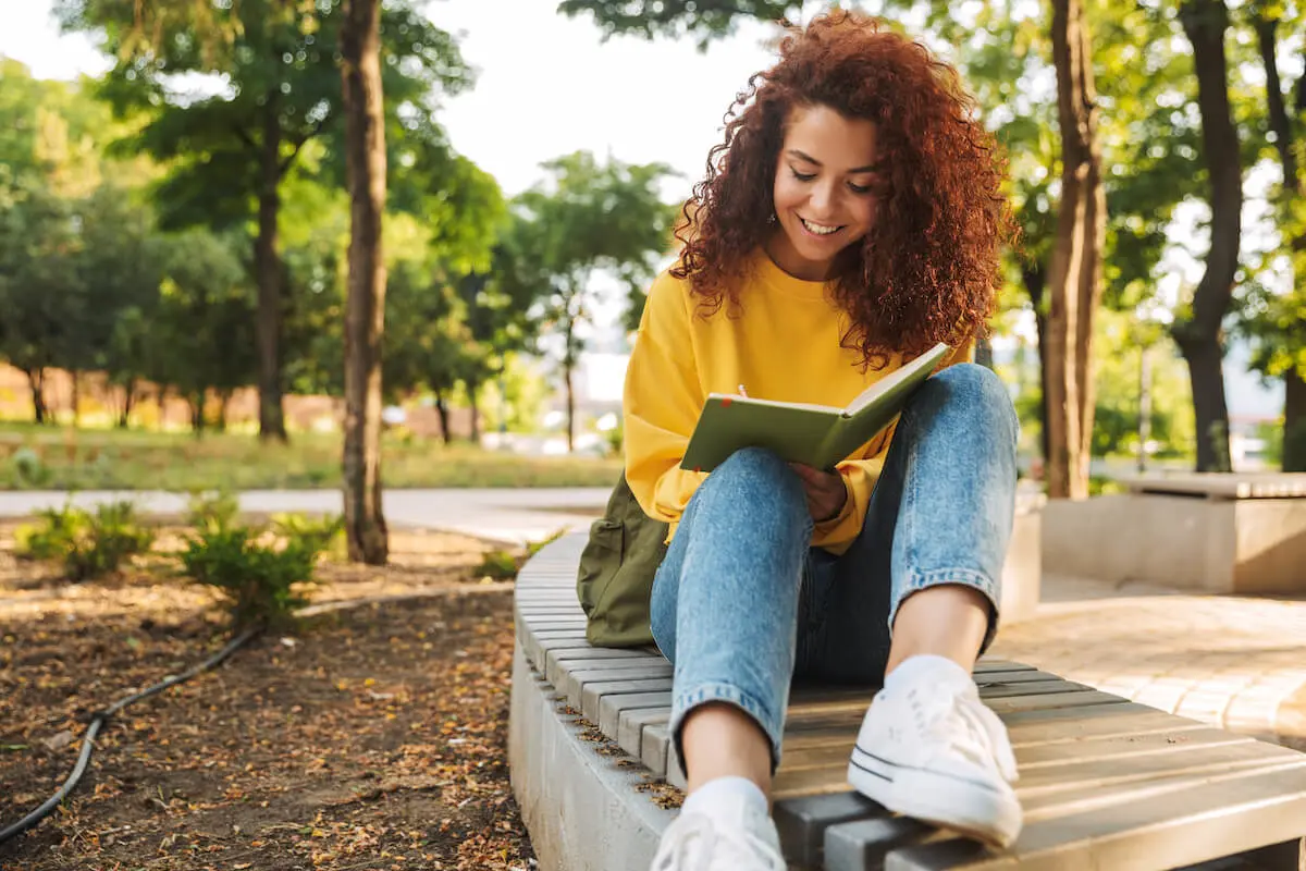 Woman writing on a notebook