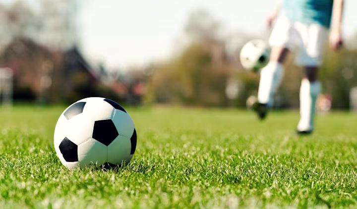 Kids playing soccer.
