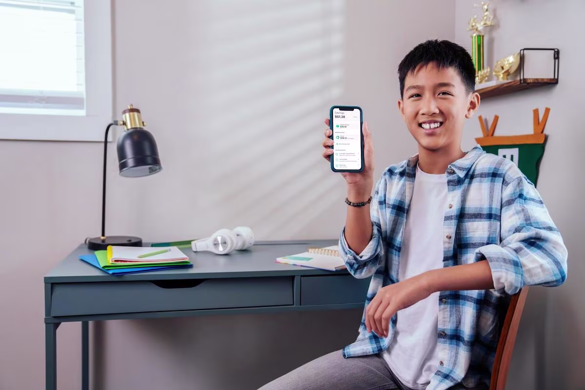Boy showing his phone to the camera