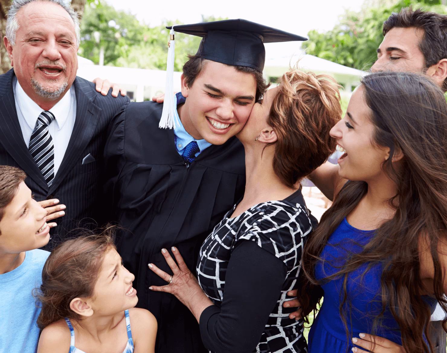 family at a teen boy's graduation ceremony