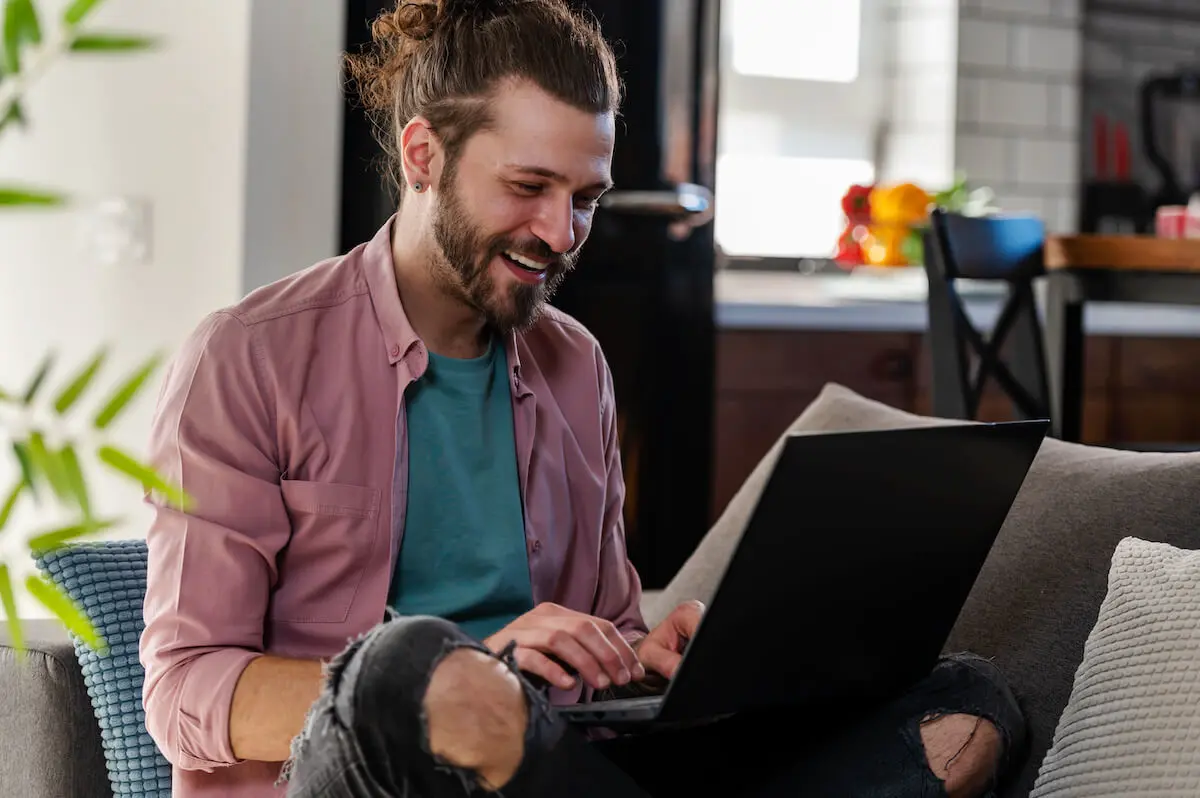 Prequalified vs preapproved: man using a laptop at home