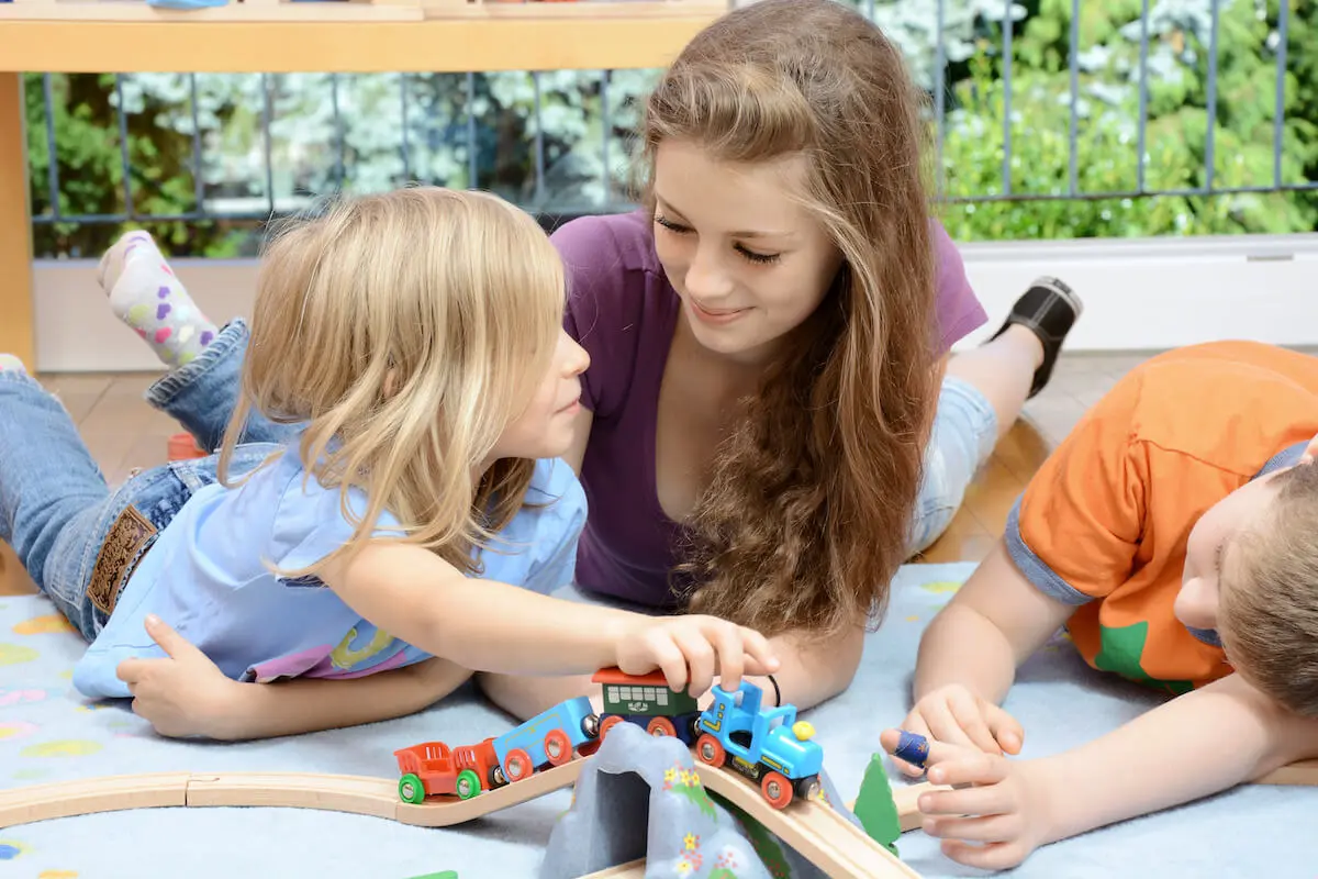Flexible jobs for college student: babysitter playing with 2 kids