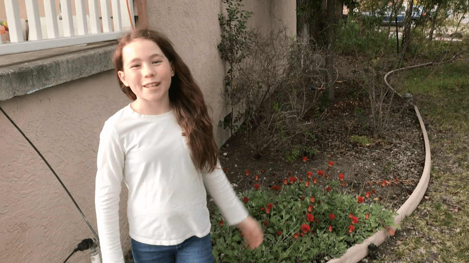 young girl in her yard