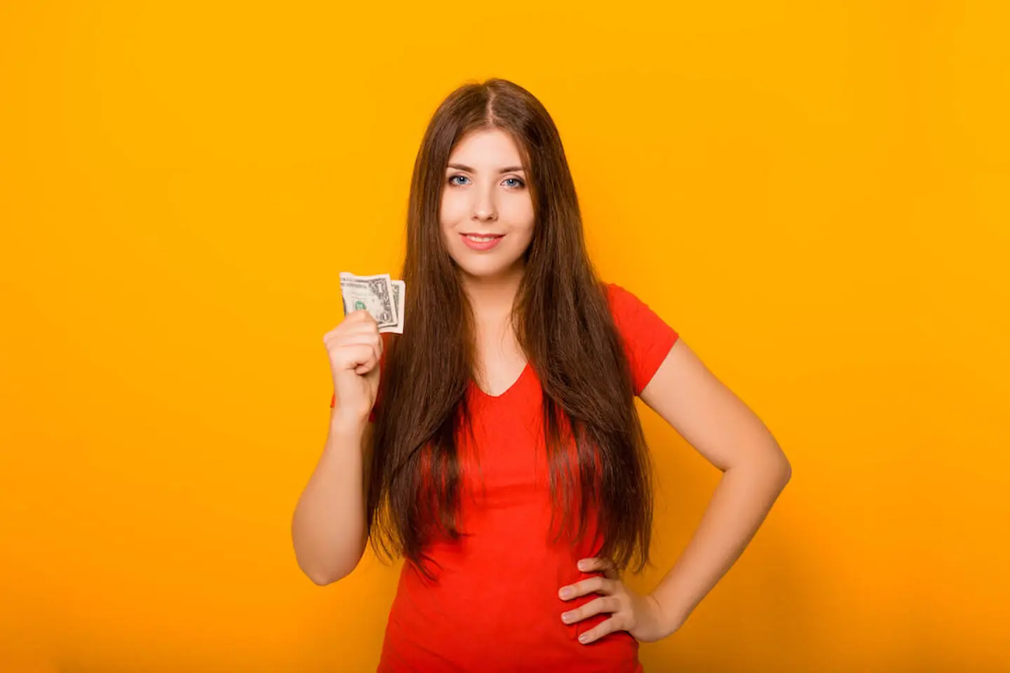 Woman holding a dollar