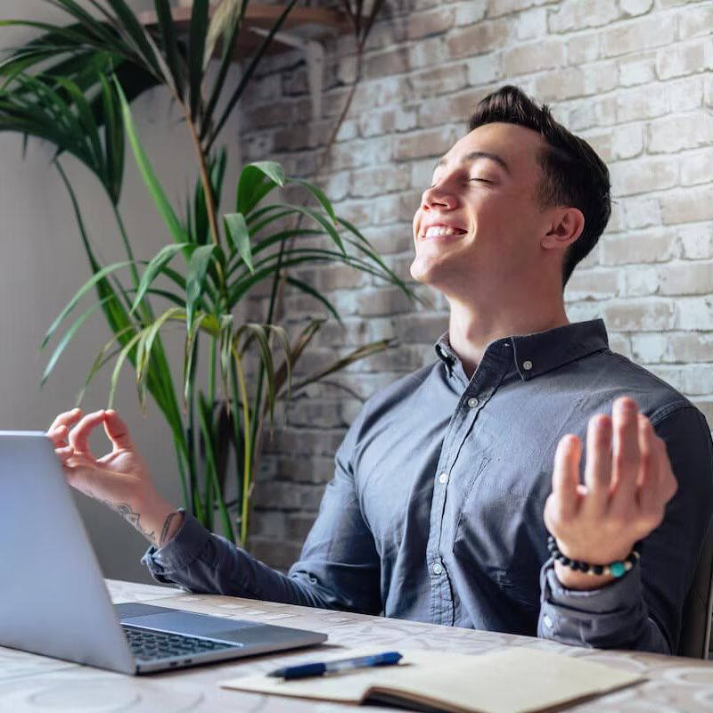 Entrepreneur happily meditating