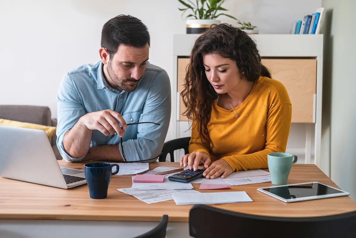 Couple using a calculator