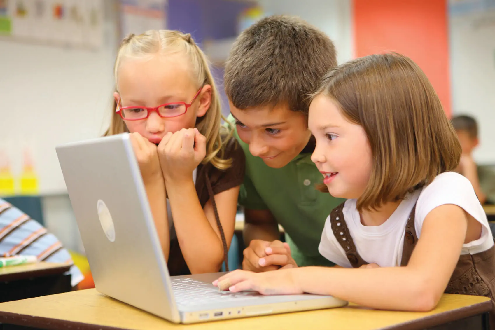 kids looking at a laptop